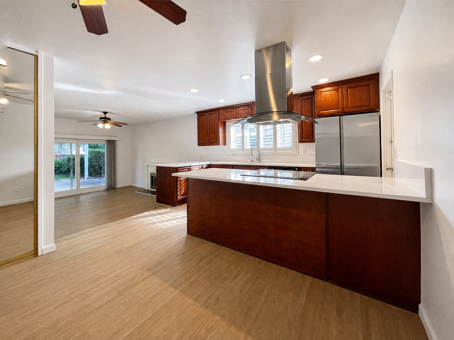 Remodeled chef's kitchen with island and high-end appliances