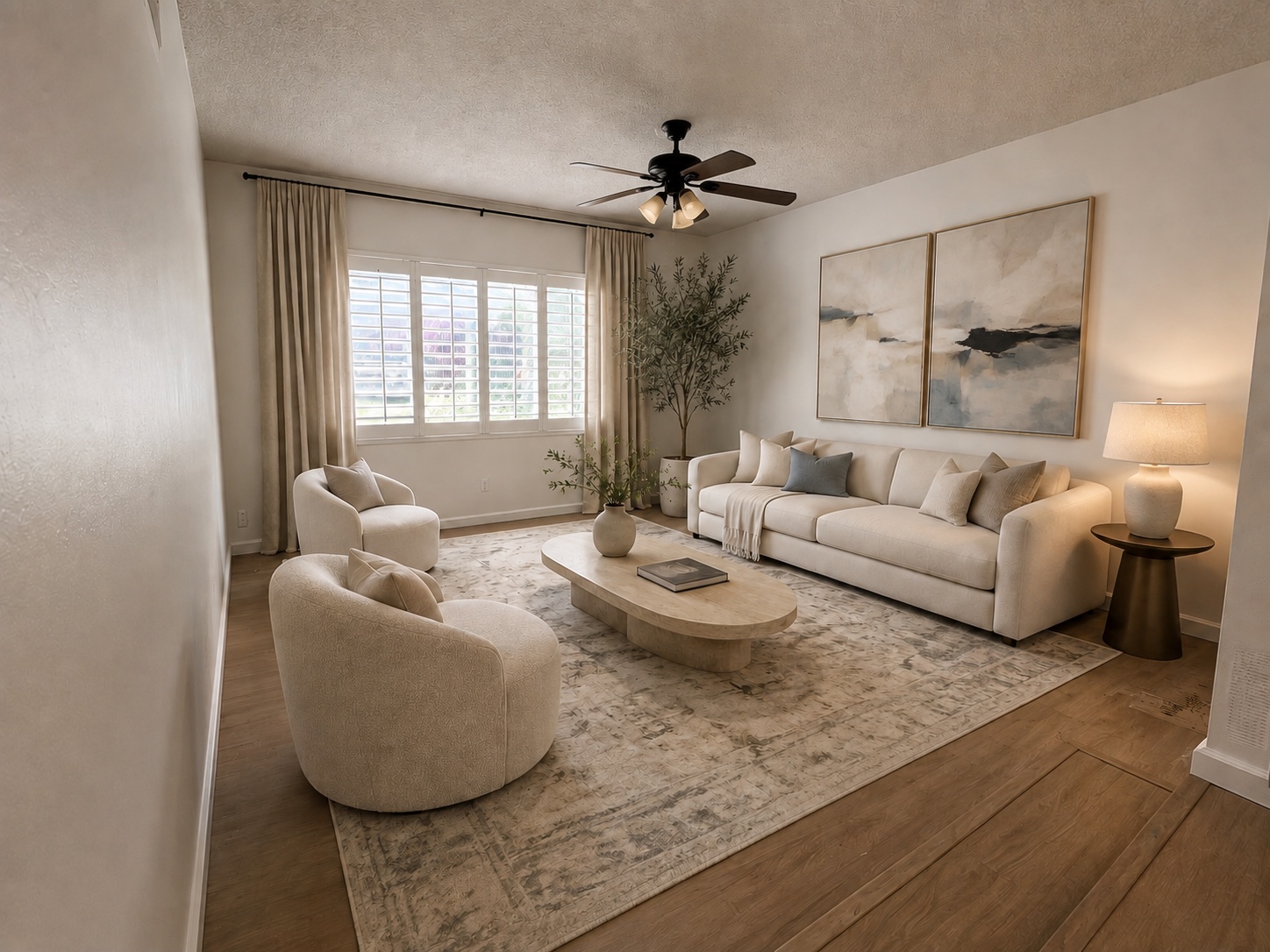 Virtually staged living room with sofa and area rug; furnishings are illustrative